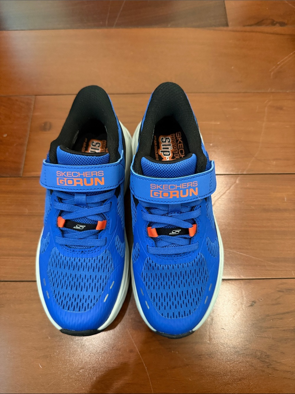 Skechers GORUN Kids' Sneaker in Bright Blue with Orange Accents